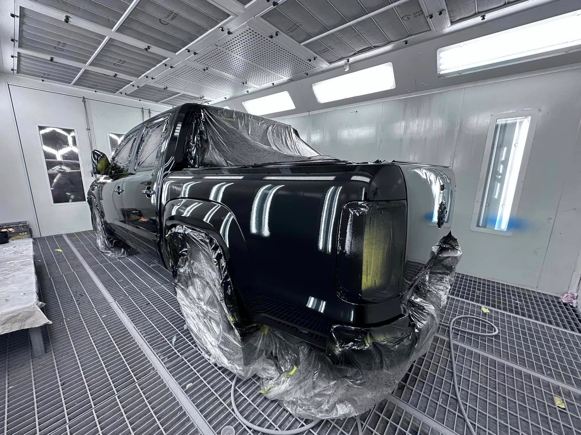 Black 4WD SUV after a full respray in the booth