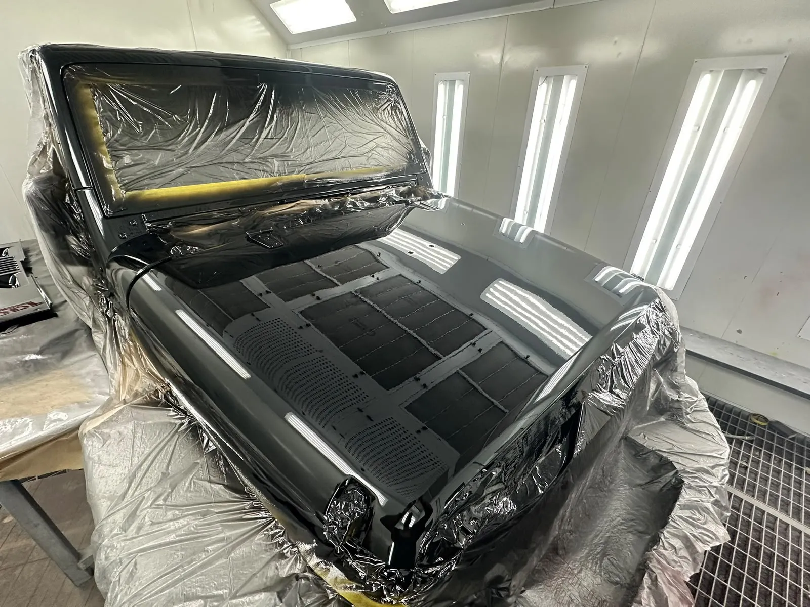 Classic truck front end resprayed gloss black in the spray booth