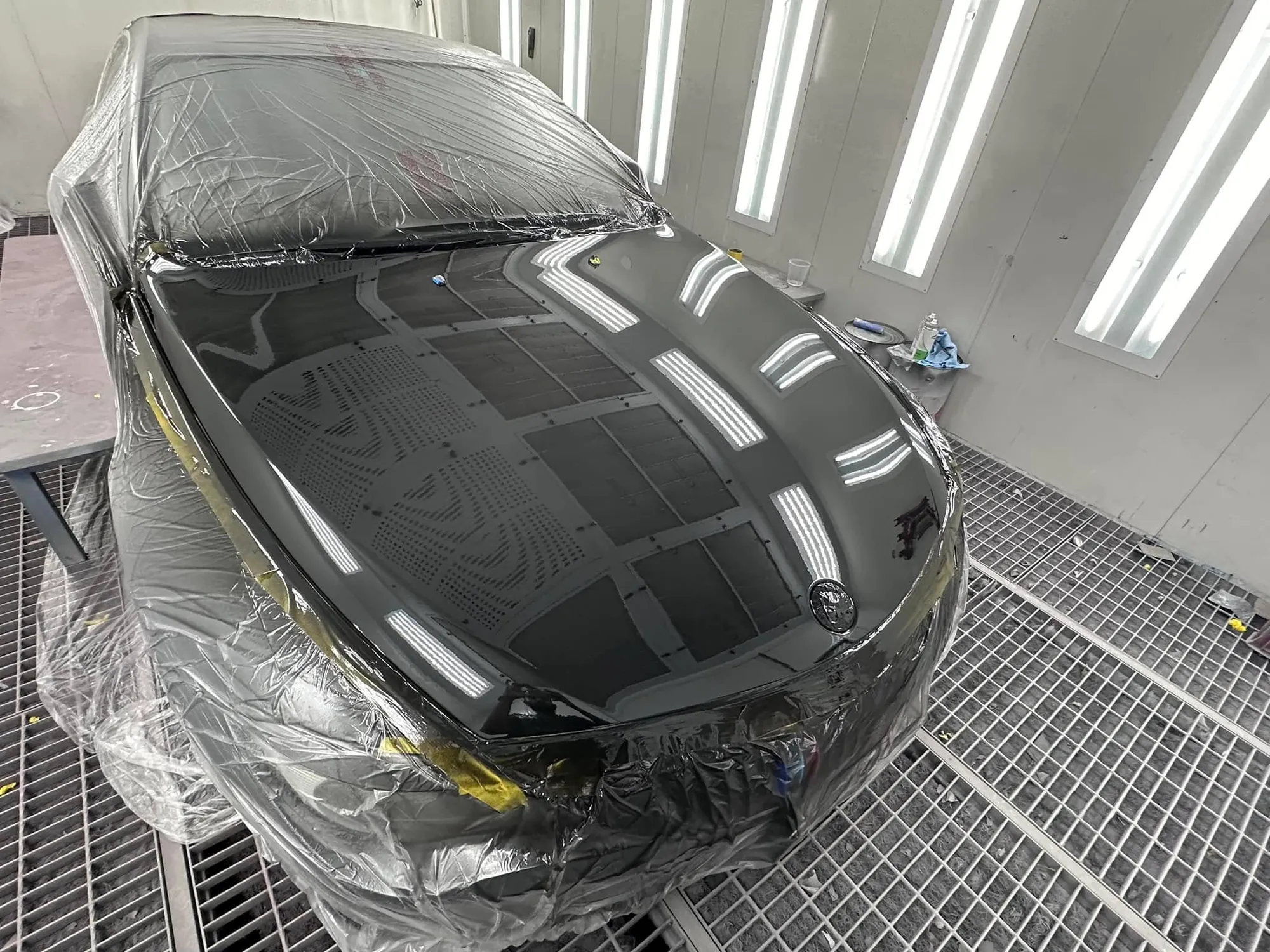 Black sports car front and bonnet after respray