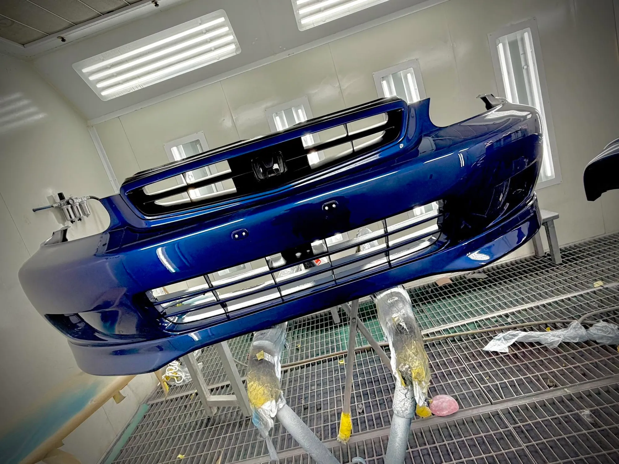 Blue front bumper bar freshly resprayed