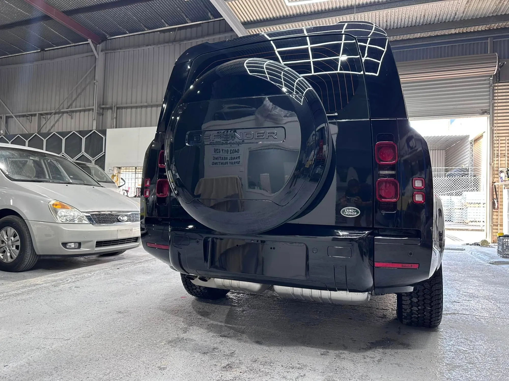 Rear of a black Land Rover Defender resprayed by DDP