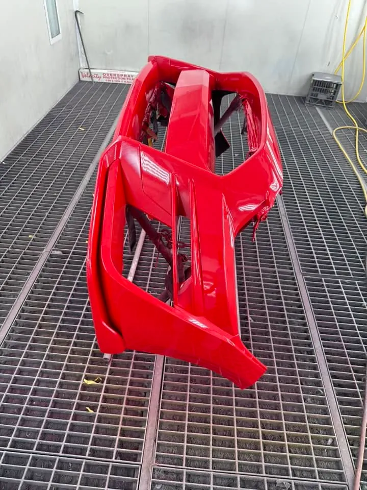 Red front bumper bar after respray