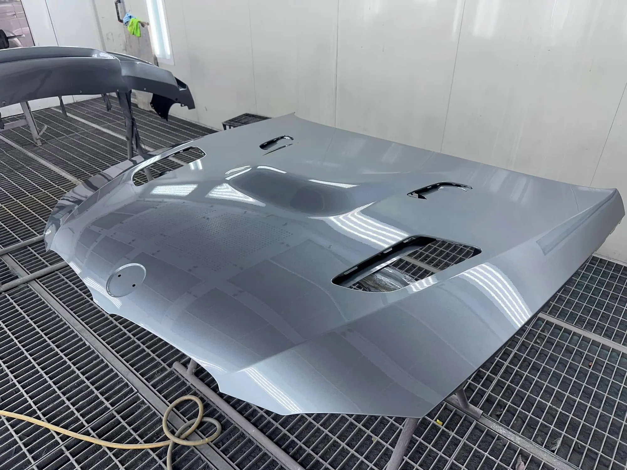 Vented performance-car bonnet resprayed in silver